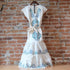 Sendero Provisions Co. The Emilia Dress in Ivory-Teal with floral embroidery.