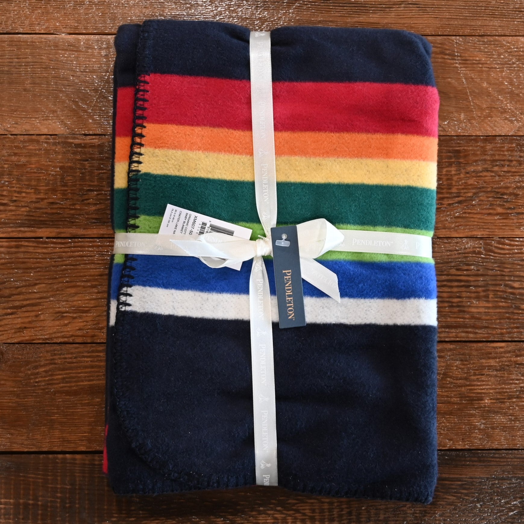 View of Pendleton Crater Lake Navy organic cotton baby blanket with stripe pattern