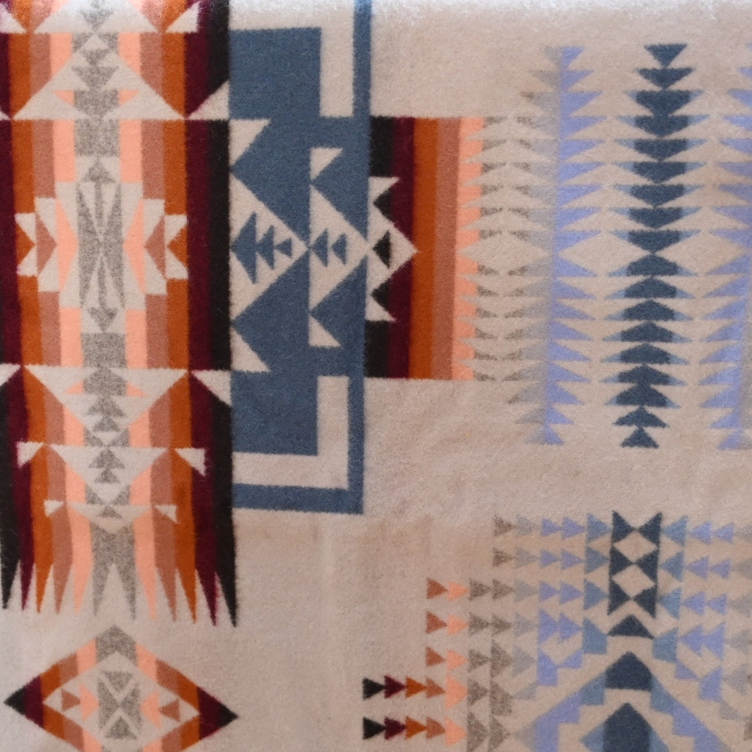 View of Pendleton Chief Joseph Rosewood queen blanket in soft blue, cream, and pink tones