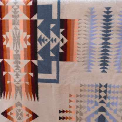 View of Pendleton Chief Joseph Rosewood queen blanket in soft blue, cream, and pink tones