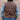 View of Schaefer whiskey-colored leather vest with Western yoke design, lapel front, and dual pockets