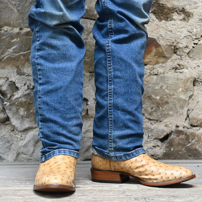 View of Hondo full quill umber ostrich boot with brown volcano top, medium round toe, and pull straps