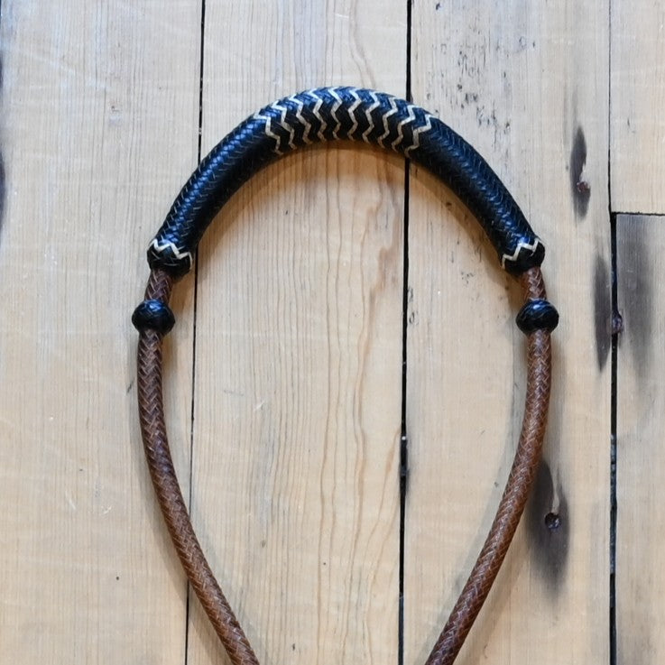 1/4 inch rawhide bosal with 16 plait construction in brown with black and white accents