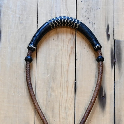 1/4 inch rawhide bosal with 16 plait construction in brown with black and white accents