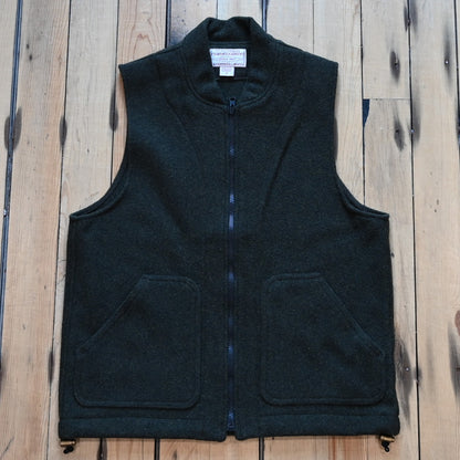 Forest green Filson Mackinaw Wool Vest Liner with zip-front, hand-warmer pockets, standing collar, and drawcord waist