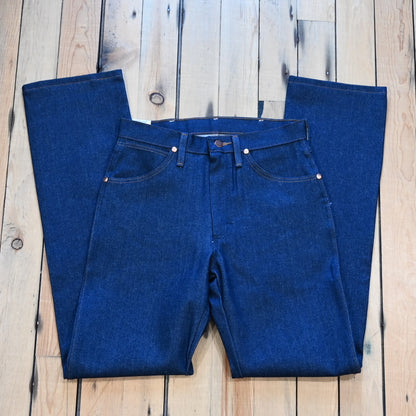 View of Wrangler Men’s Cowboy Cut Original Fit jeans in Prewashed Indigo with boot leg and five-pocket styling
