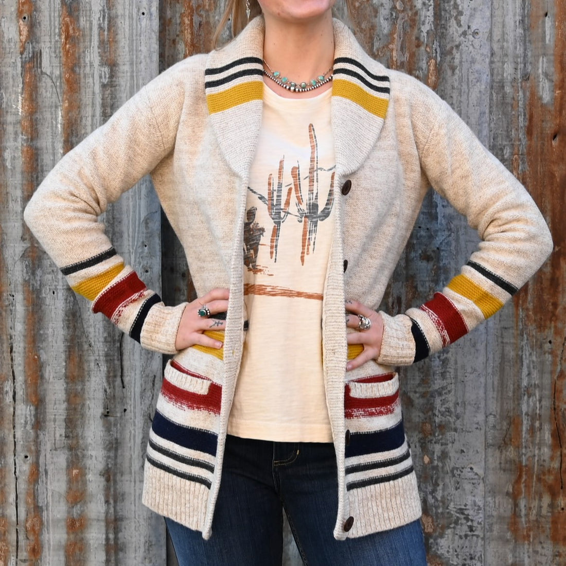 View of Pendleton lambswool cardigan with yellow, red, and black stripes and shawl collar