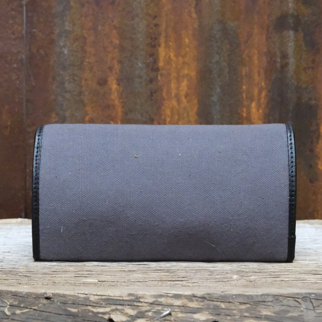 Myra Yellowstone Roverra Ash canvas sling wallet in black with leather trim and zipper closure