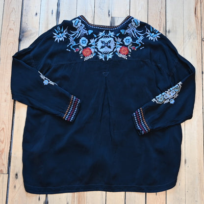 View of Johnny Was sanded black blouse with tonal embroidery on front and shoulders