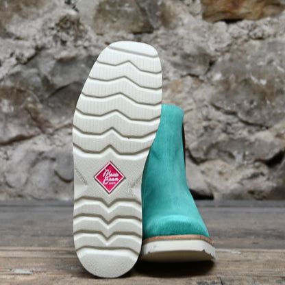 View of Macie Bean ladies turquoise suede wedge bootie with cutter toe and white swedge sole