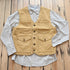 View of Schaefer brushcloth vest in suntan canvas with utility pockets and brass buttons