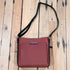 Gun Toten Mamas conceal carry Slim Cross-Body bag in cinnamon leather with black trim
