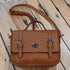 Gun Toten Mamas saddle brushed cowhide schoolgirl crossbody satchel with flap and conceal carry compartment
