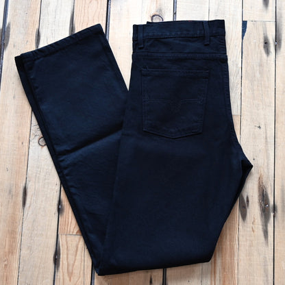 View of Kimes Ranch James Jeans in Black, showcasing straight-leg fit and integrated knife pocket