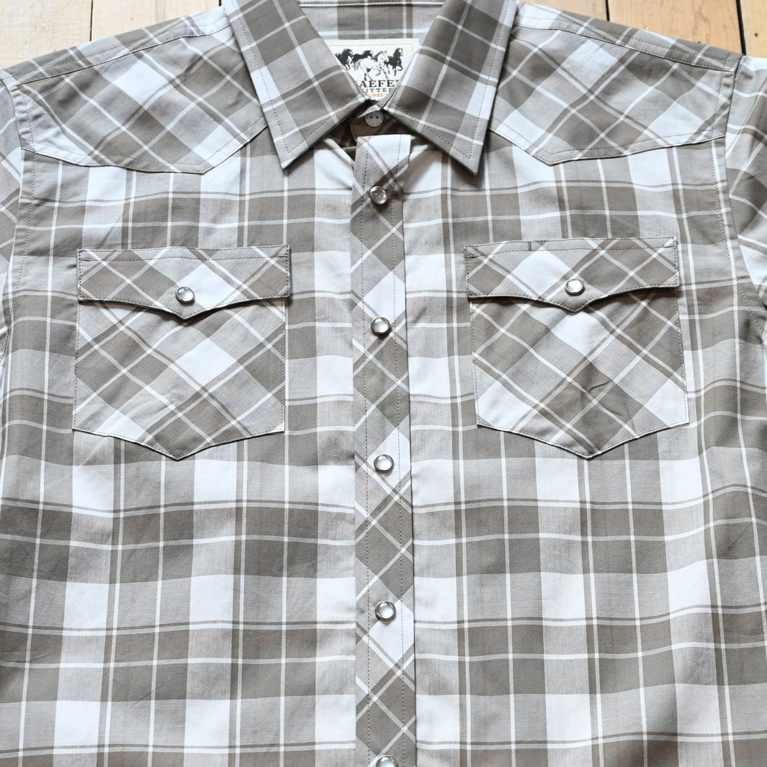 View of Highlands short sleeve vintage cotton pearl snap shirt with Western yoke and chest pockets
