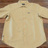 View of Kimes Ranch MC Cooper Short Sleeve Button-Up Shirt in Gold, featuring a grid plaid pattern and snap button front