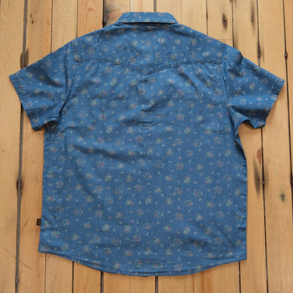 Howler Bros H-Bar-B Snapshirt in Bouquets Washed Indigo with floral print.