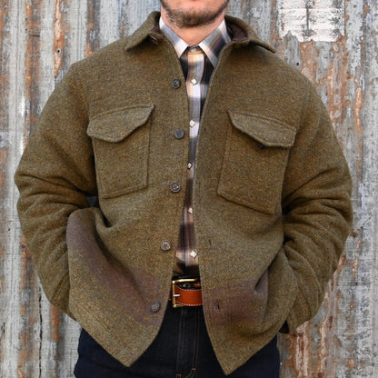 View of Filson CCC Jacquard Wool Jac-Shirt in Olive Brown Multi featuring large CCC emblem and natural horn buttons