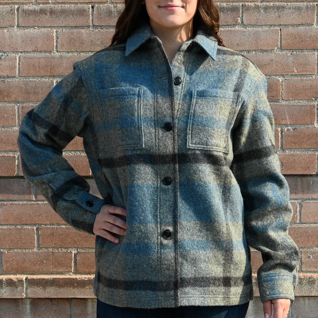 View of Filson Ladies Wool Overshirt in Ballard Plaid featuring button-front closure and adjustable cuffs