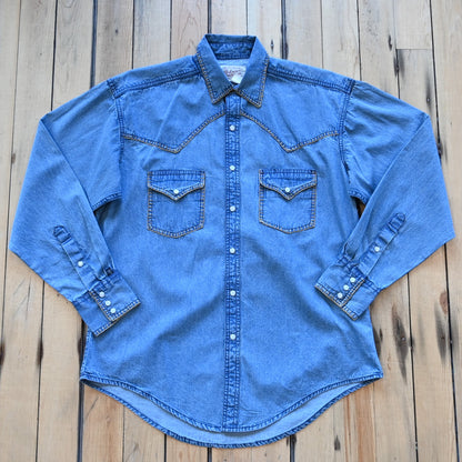 View of Rockmount men’s stonewashed denim Western shirt with blanket stitch detailing and snap front