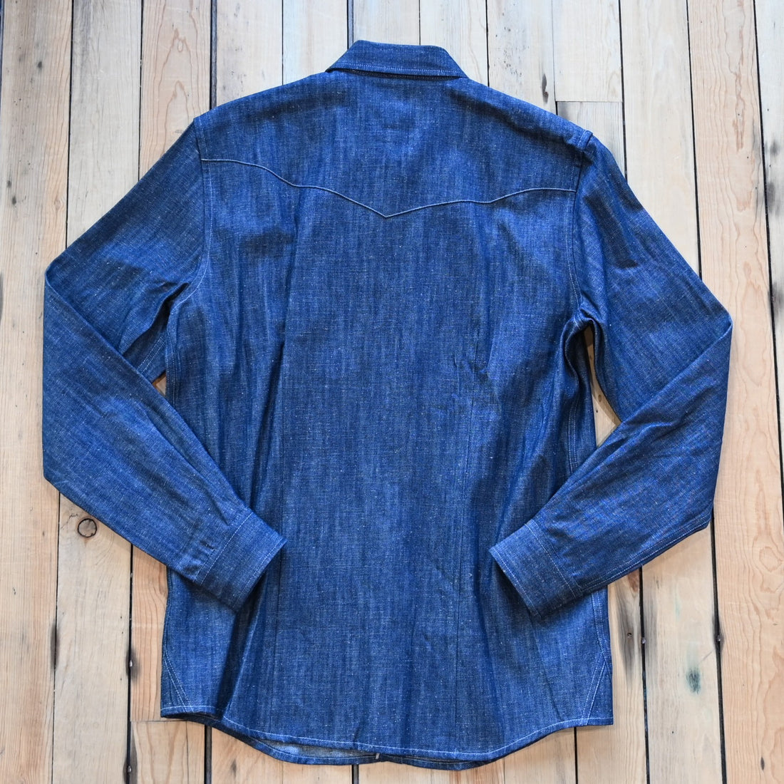 View of Blue Blanket men’s dark denim Western shirt with pearl snaps and smile pockets