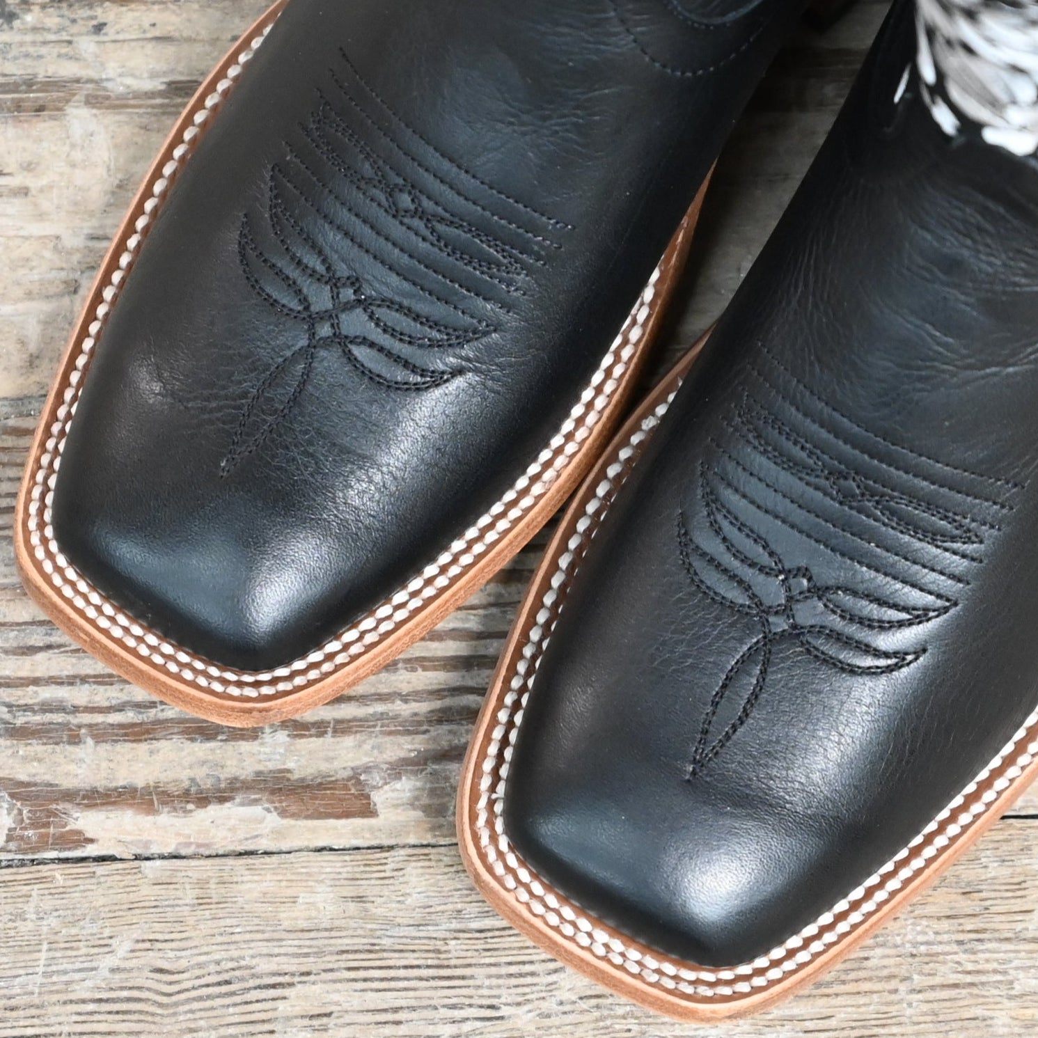 Macie Bean 13″ “Black Eyed Susan” boot with black leather and white floral stitching