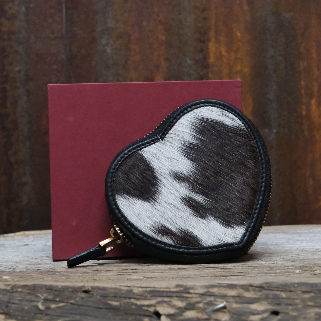 Myra black and white cowhide coin pouch with leather trim and zipper closure