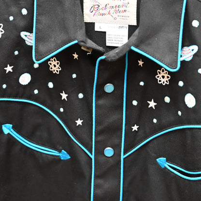View of Black Rockmount kids western shirt size Large with embroidered stars, planets, and rockets