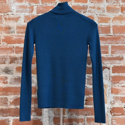 View of Pendleton rib merino turtleneck in Peacock Blue with slim fit and folded neck