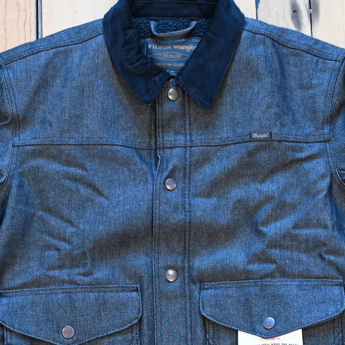 Filson × Wrangler black denim work jacket, sherpa lined with snap front and corduroy collar