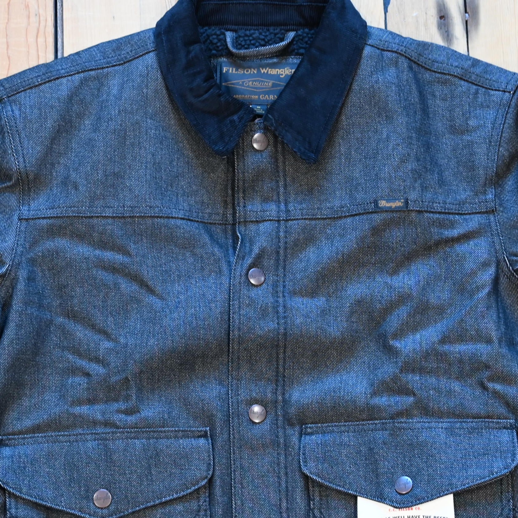 Filson × Wrangler black denim work jacket, sherpa lined with snap front and corduroy collar