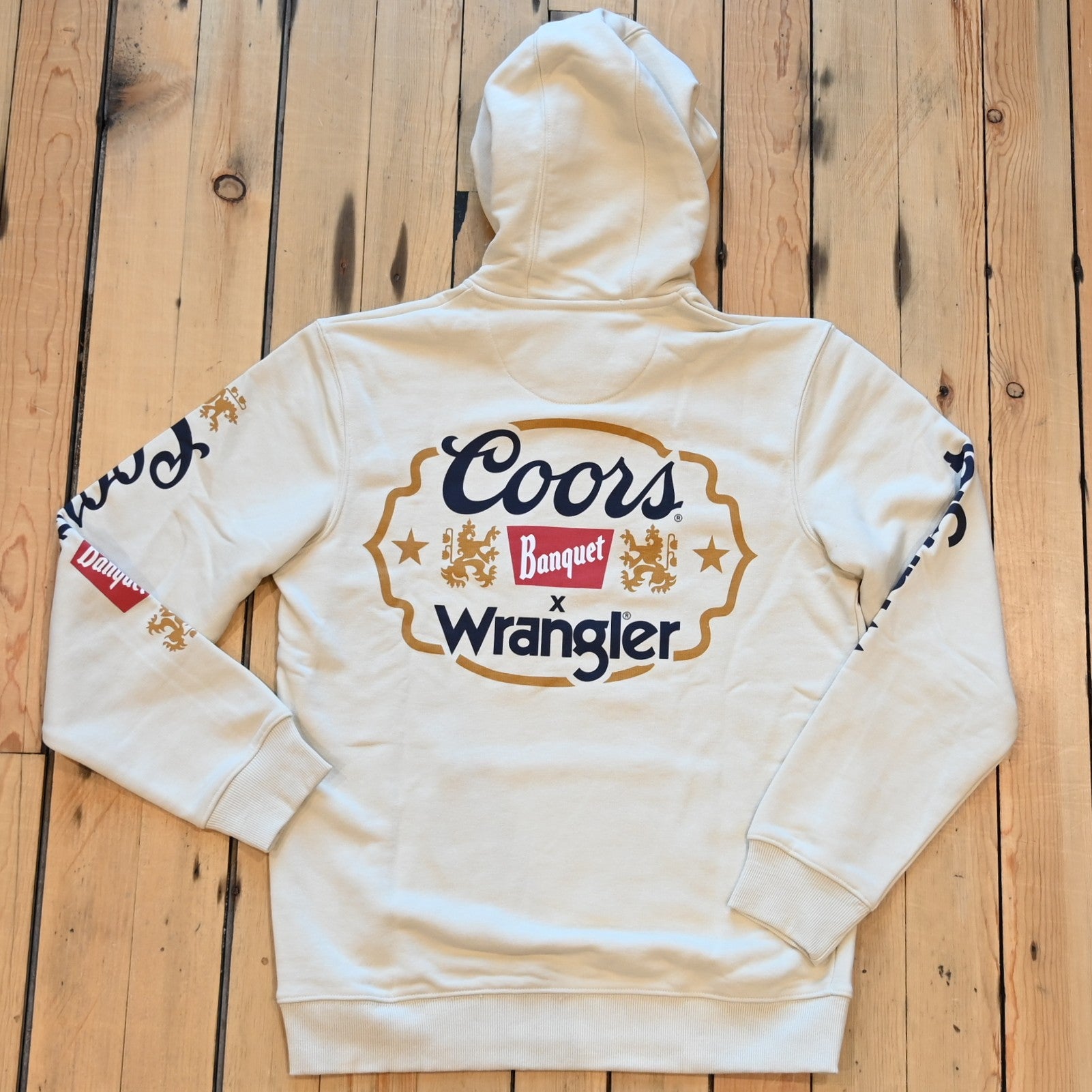 Wrangler × Coors graphic hoodie in antique white with logos down sleeves
