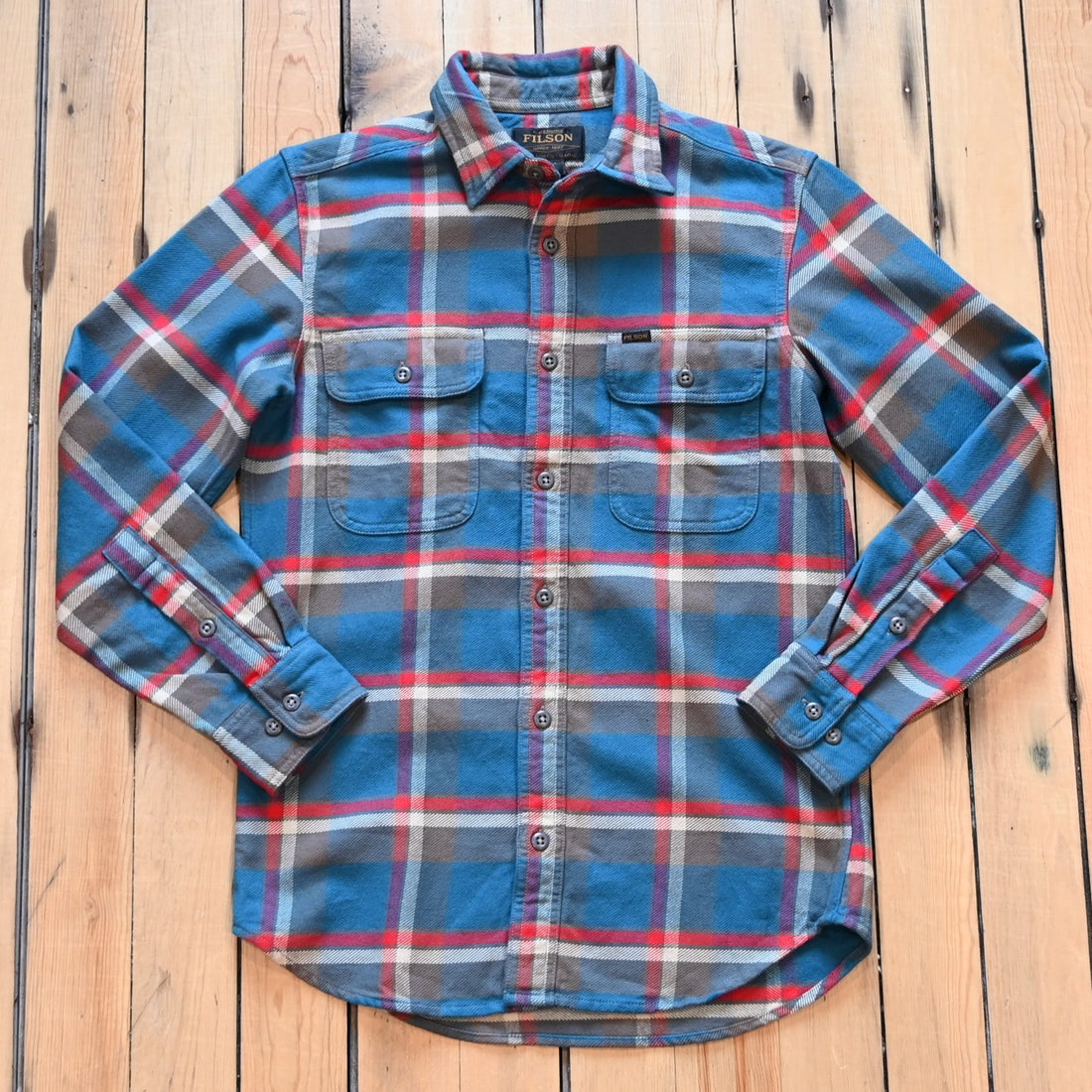 Filson Vintage Flannel Work Shirt in blue and gray multi plaid with chest pockets and button front