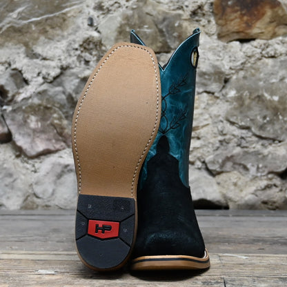 View of Horse Power 11&quot; boot with black suede vamp, blue volcano shank and top, cutter toe, and pull holes