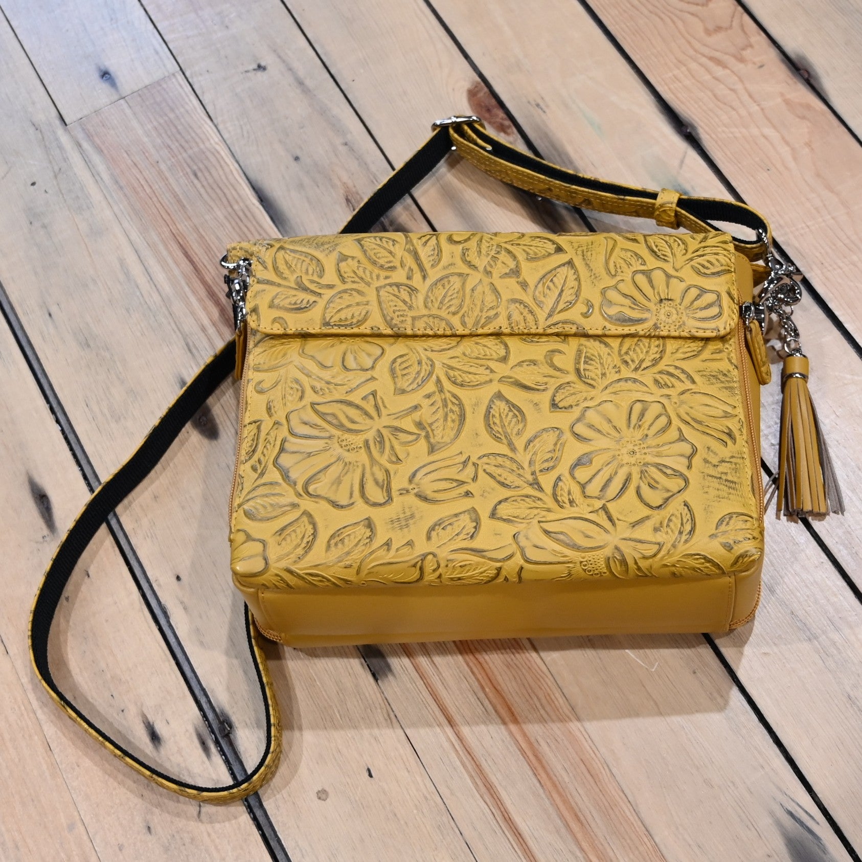 Mustard debossed USA cowhide conceal carry clutch by Gun Toten Mamas with rose leaf pattern and zipper access