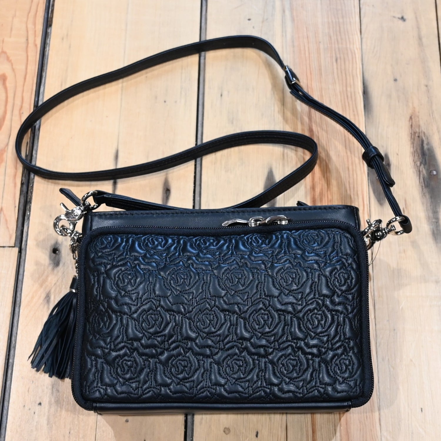 Gun Toten Mamas black embroidered lambskin clutch with rose design and conceal carry features