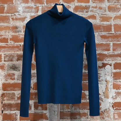 View of Pendleton rib merino turtleneck in Peacock Blue with slim fit and folded neck