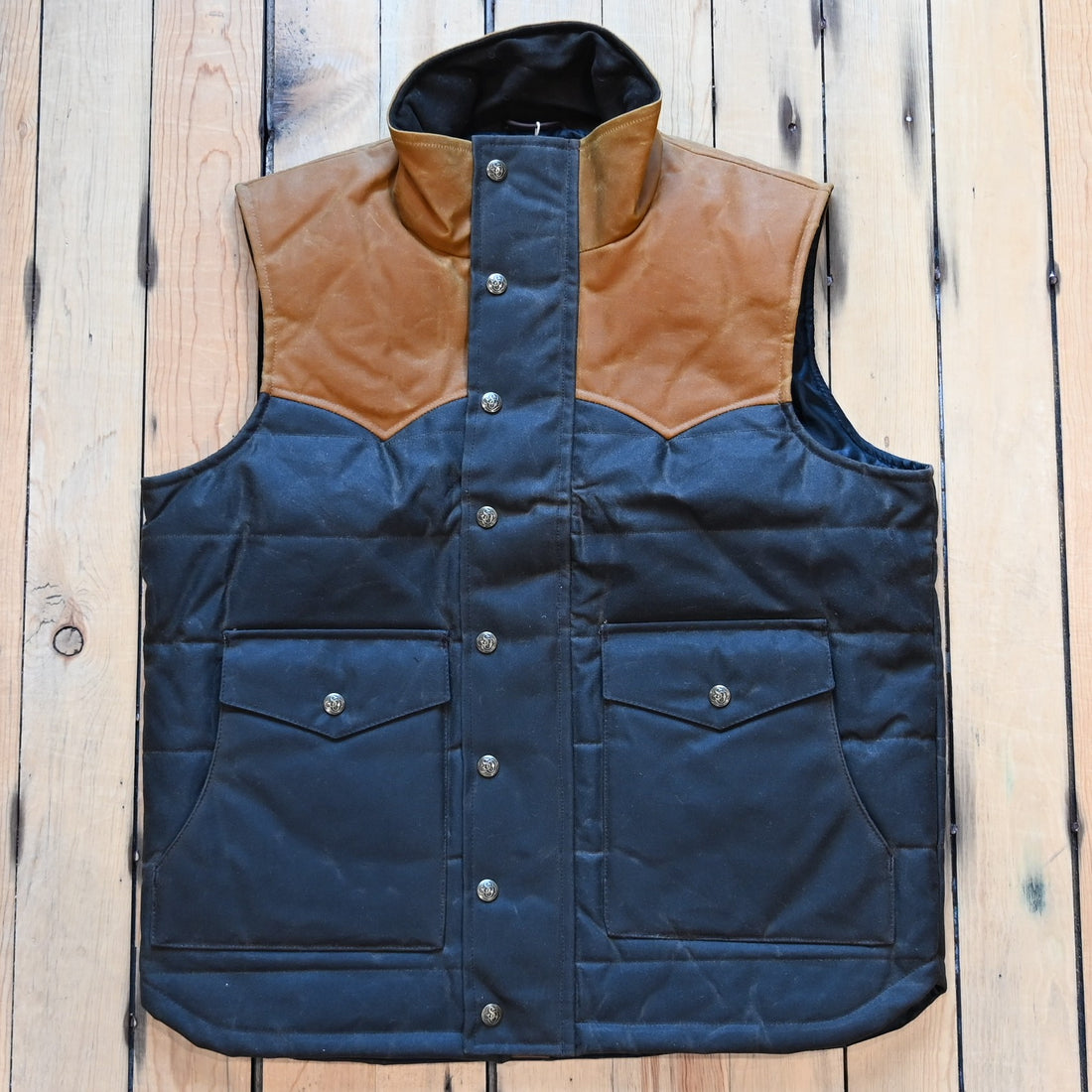 Schaefer Outfitter RangeWax Puffer Vest in waxed cotton canvas with high collar, wool insulation and front utility pockets