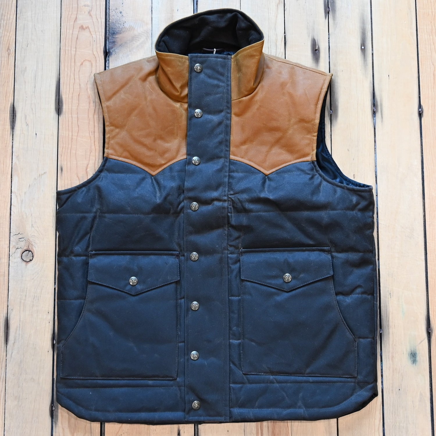 Schaefer Outfitter RangeWax Puffer Vest in waxed cotton canvas with high collar, wool insulation and front utility pockets