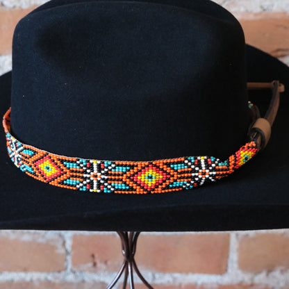 Adjustable Sambboho Maui beaded hatband styled on a western felt hat at Atomic 79.
