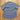 Howler Brothers Broncbuster snapshirt in Indigo featuring contrast piping and pearl snaps.