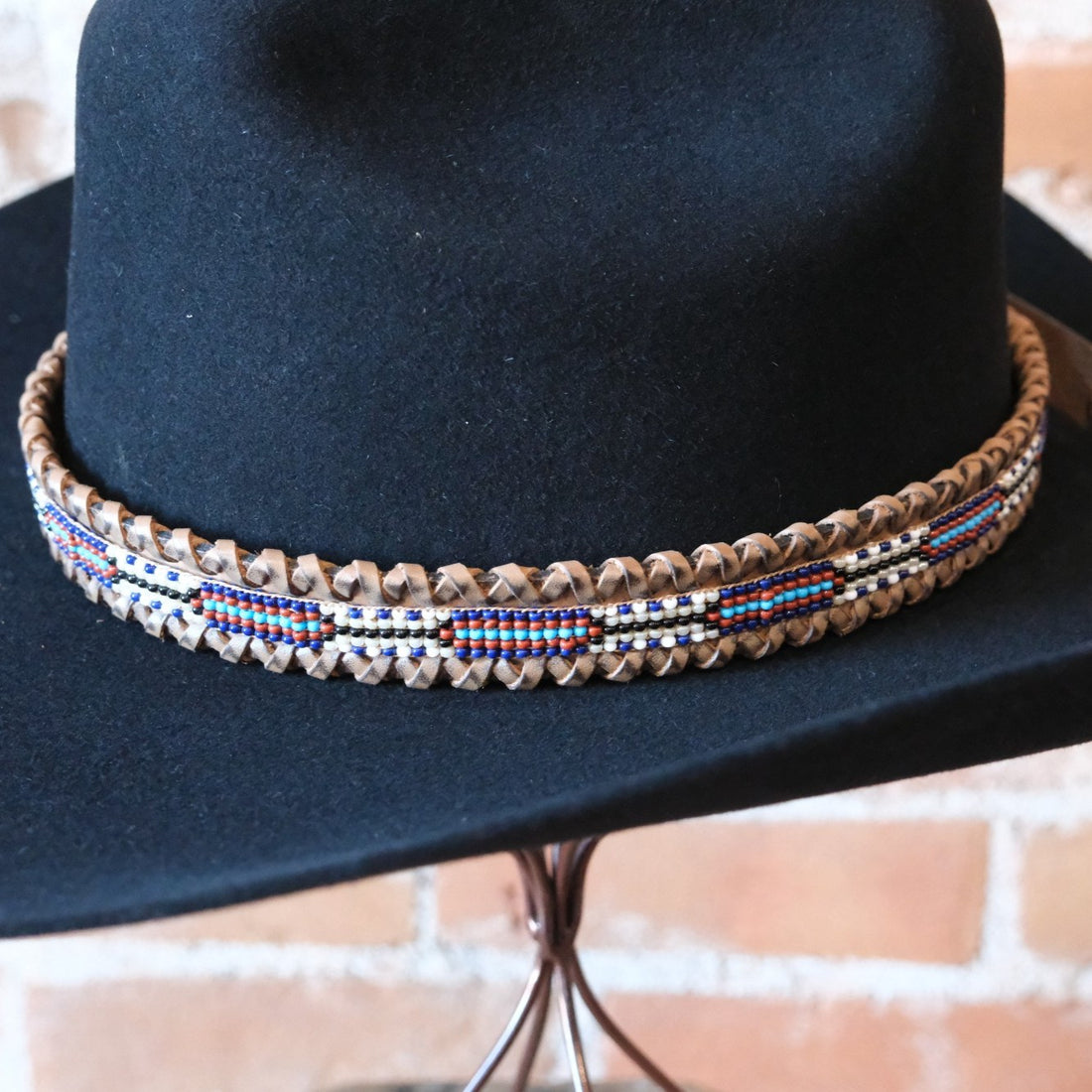 Adjustable Sambboho beaded hatband on a western felt hat at Atomic 79.