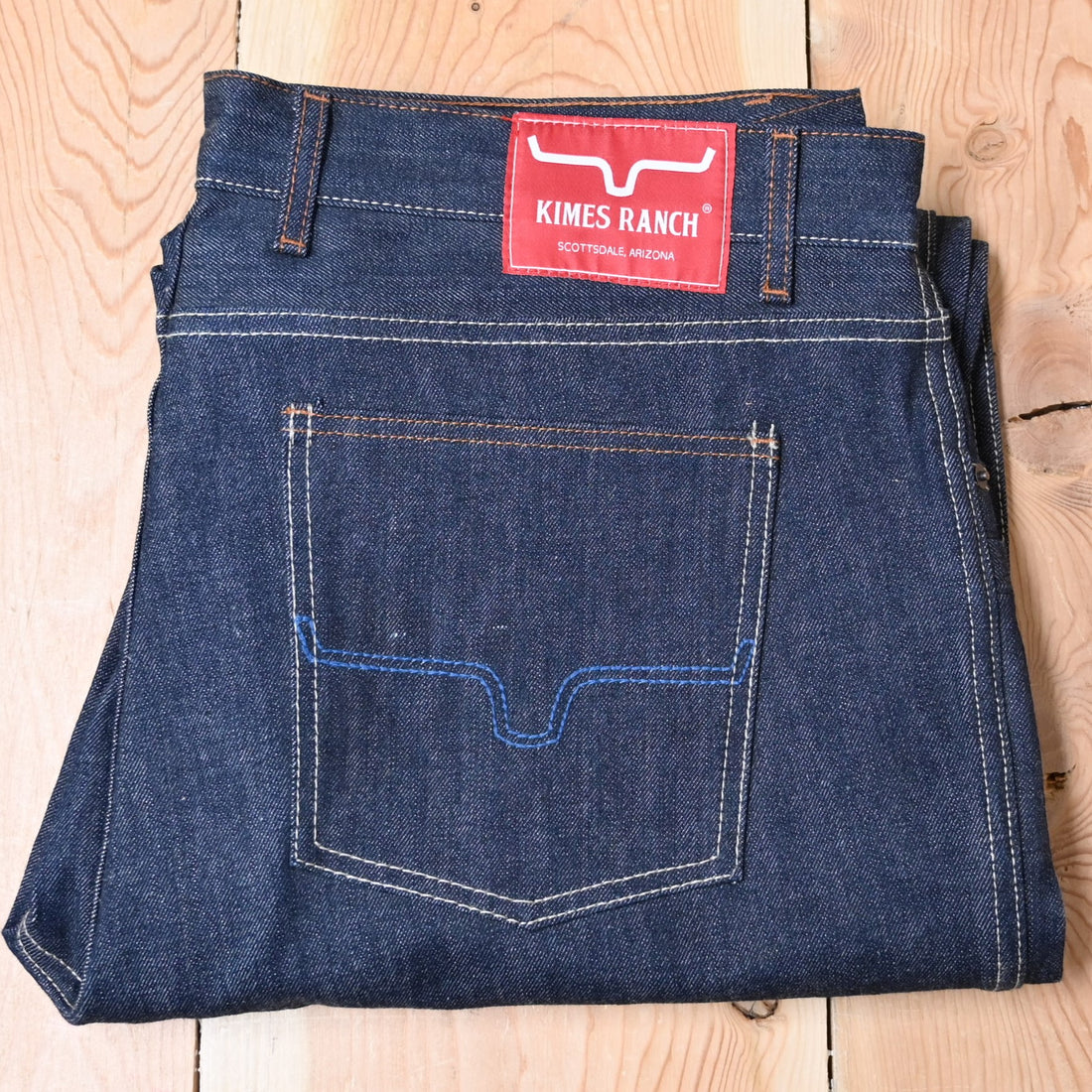 View of Kimes Ranch Raw Dillon Jeans in Indigo featuring off-white stitching and integrated knife pocket