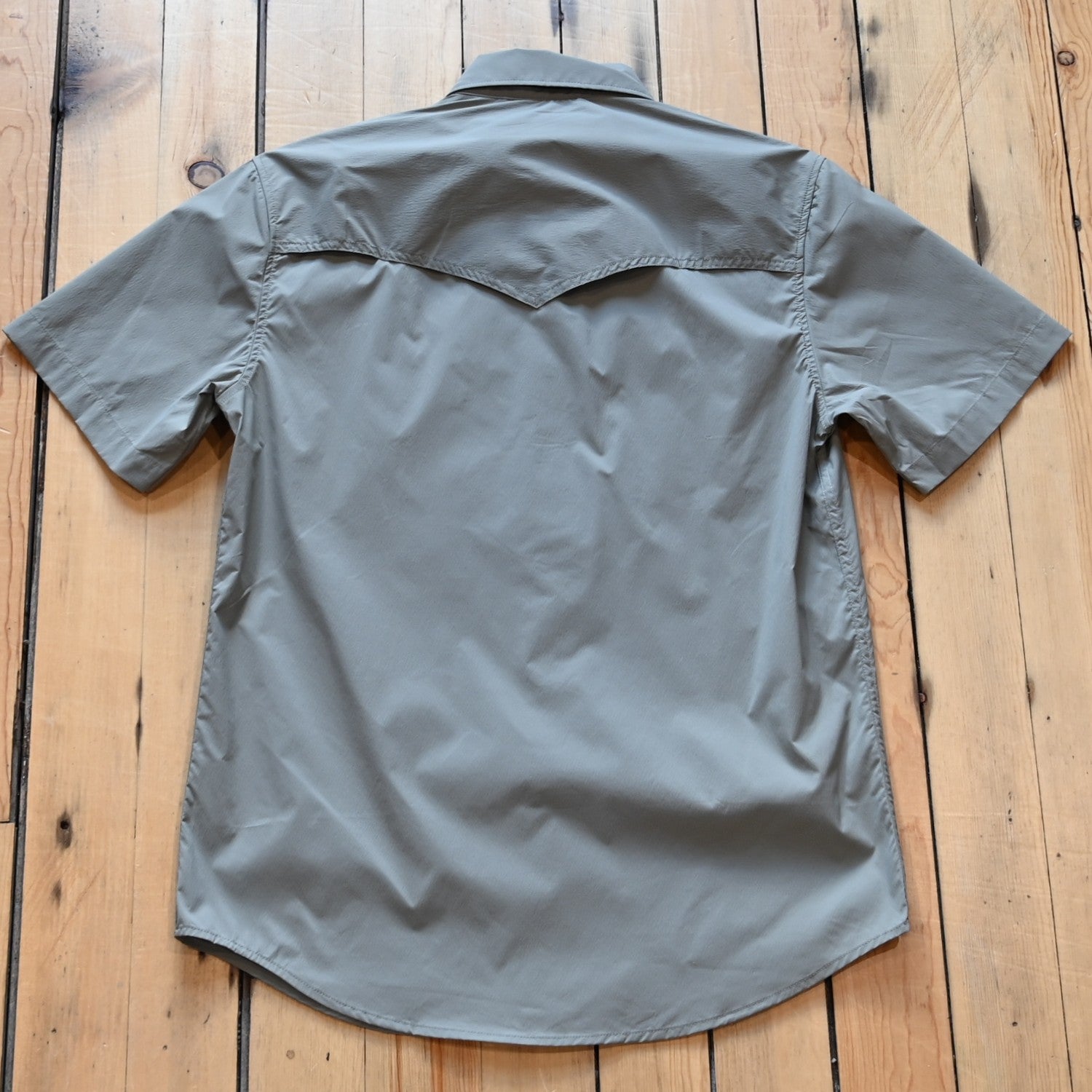 View of Schaefer men’s sage short‑sleeve RangeTek Western snap shirt with mesh vent and security pocket