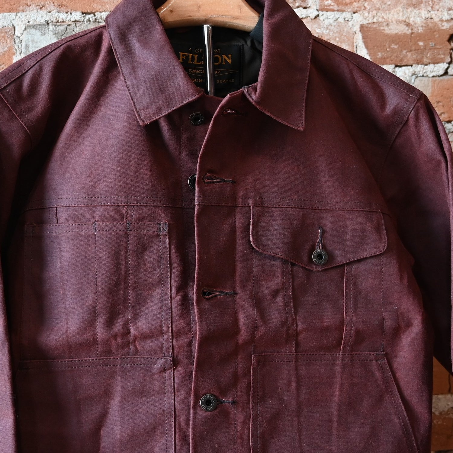 Filson Tin Cloth Short Lined Cruiser Jacket in Fired Brick with metal buttons and utility pockets