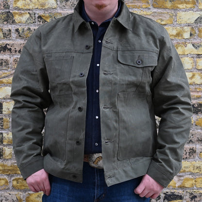 View of Filson Tin Cloth Short Lined Cruiser Jacket in Assorted Colors, showcasing durable waxed cotton exterior and adjustable cuffs and hem