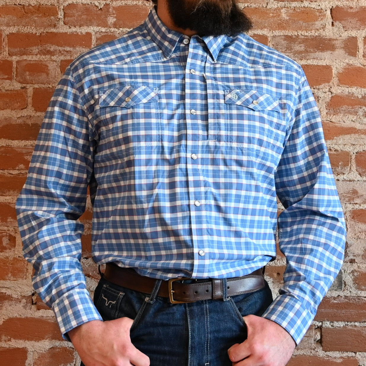 View of Schaefer blue plaid Western snap shirt with mesh-back vent, chest pockets, and yoke detailing