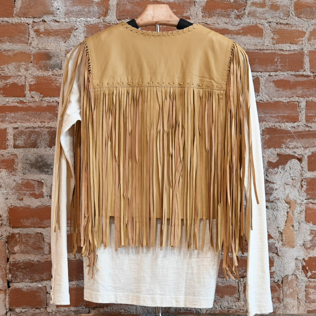 View of Double D Ranch Sonora Vest in Straw featuring full-length fringe and tonal leather lacing details