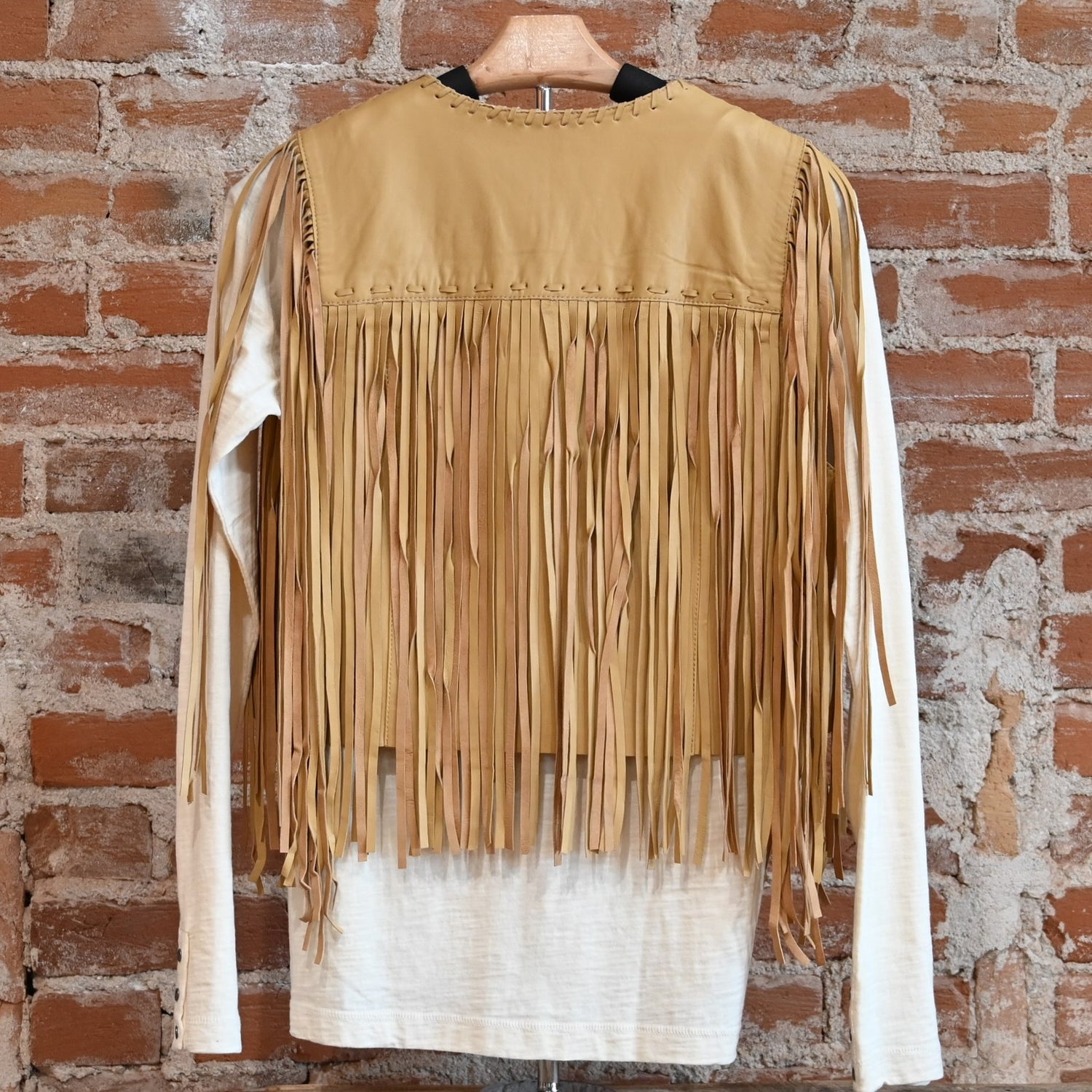 View of Double D Ranch Sonora Vest in Straw featuring full-length fringe and tonal leather lacing details