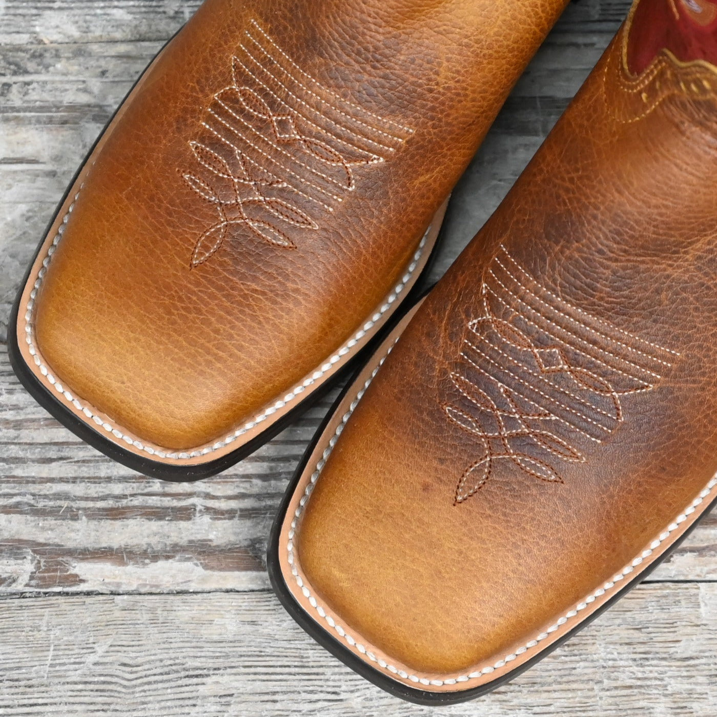 View of Hondo 13&quot; cowboy boot with red volcano top, rust oil tan vamp, wide square toe, and spur ledge
